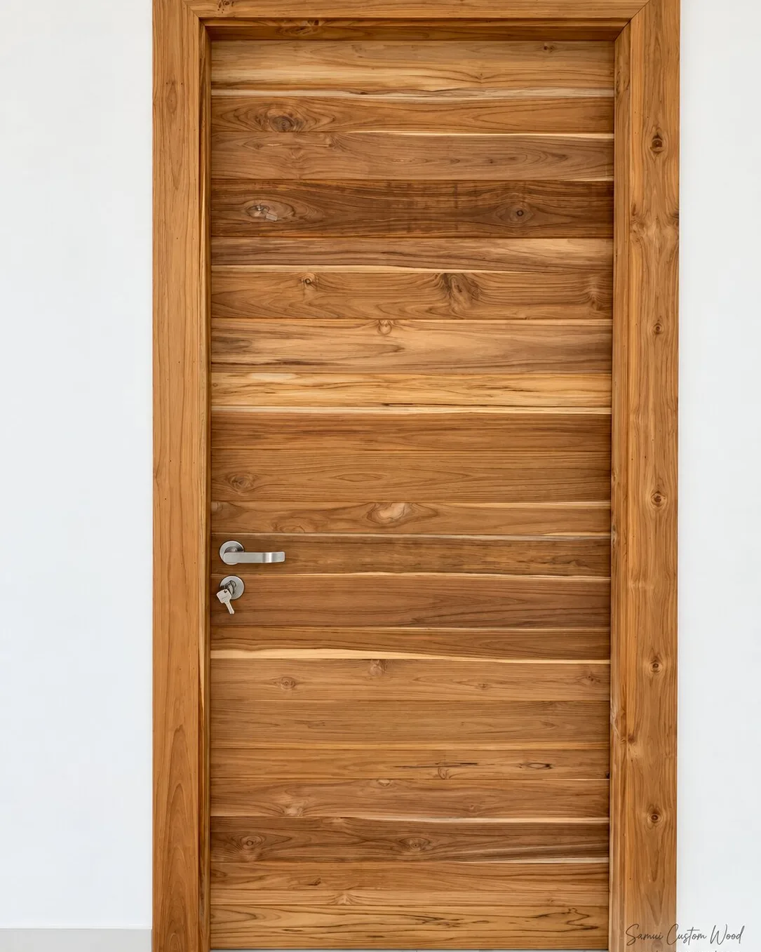 Horizontal-plank teak door with lever handle in a wide solid teak frame