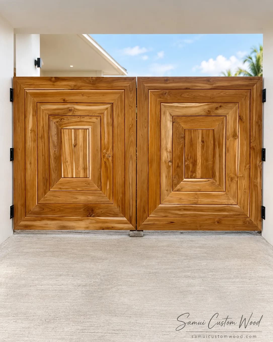 Pair of layered solid teak driveway gates between white walls