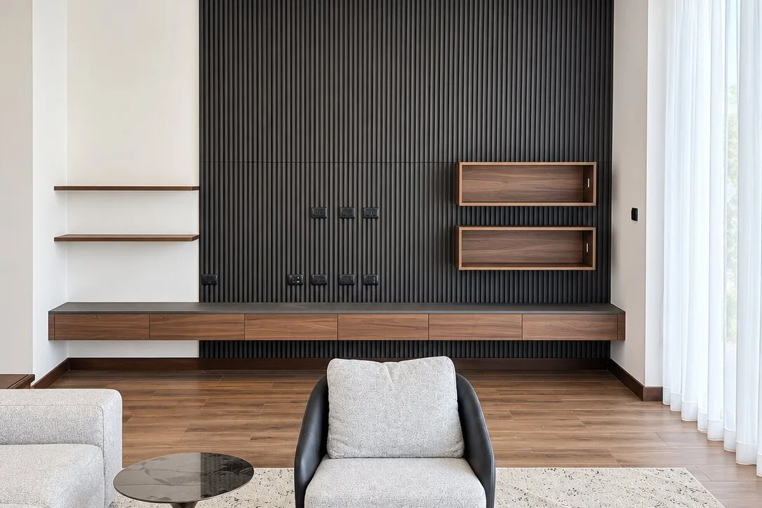 Living room with dark slatted feature wall, floating cabinet run and open display boxes